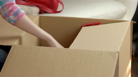 female hands packing box cardboard box with stock footage sbv 315339789