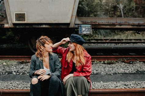 beautiful lesbian couple shoot on an abandoned railway by stocksy