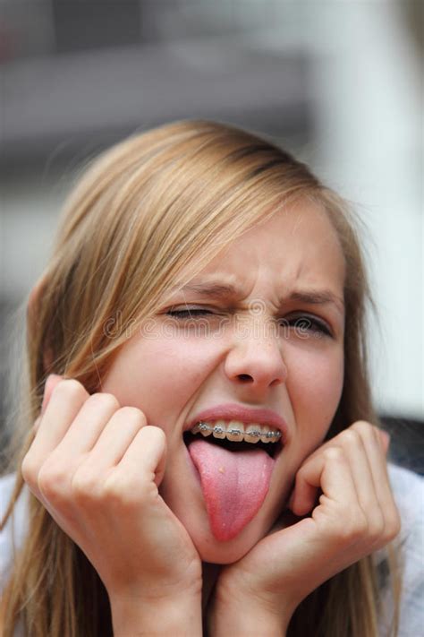 yong girl with braces sticking out her tongue stock image image of person disgusting 33023279