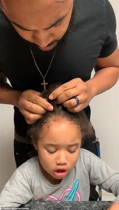 dad learns to braid his five year old daughter s hair while his own
