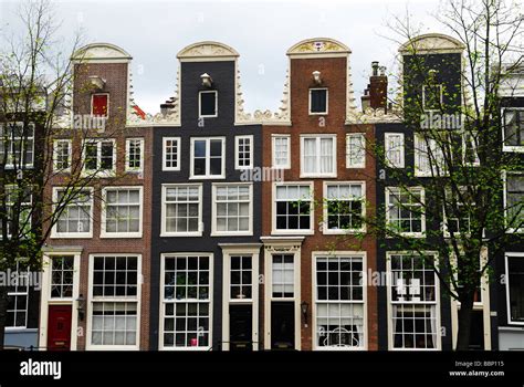 typical dutch houses   canal  amsterdam  netherlands stock photo alamy