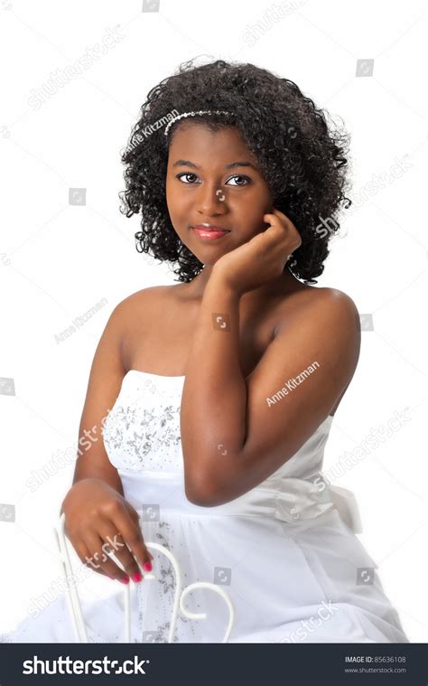 beautiful african american haitian teen girl wearing a white dress
