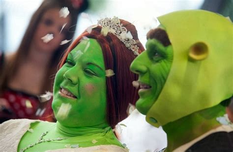 what a fairytale wedding couple tie the knot dressed as shrek and