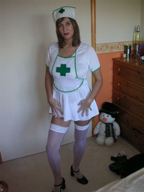 busty british milf demi dressed in a nurses uniform