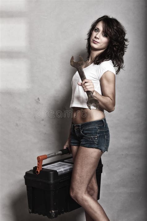 girl holding toolbox and wrench spanner stock image