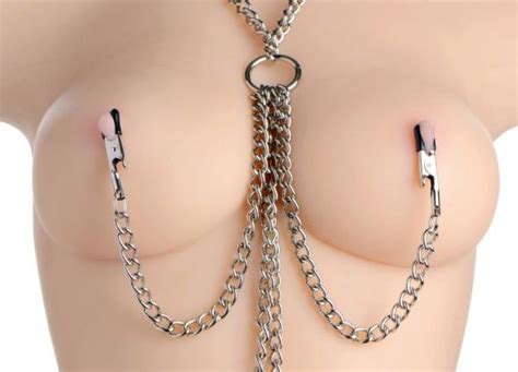 chained collar nipple clamps and clitoris clamp set on