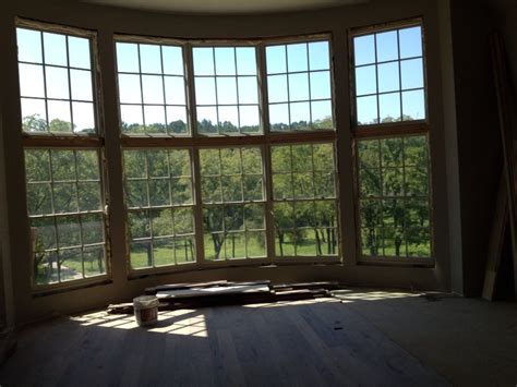 massive curved window wall pella architect series double hung windows  fixed double hung