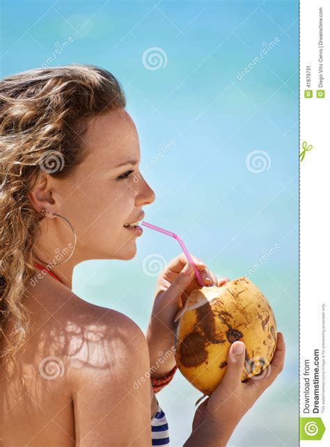 Portrait Of Woman Relaxing With Cocktail At Cuban Beach