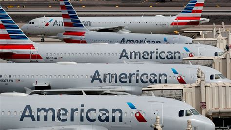 american airlines cancels hundreds  flights  staff shortages maintenance issues antigua