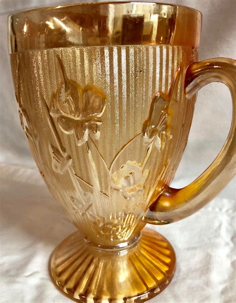 antique iris  herringbone marigold carnival glass pitcher