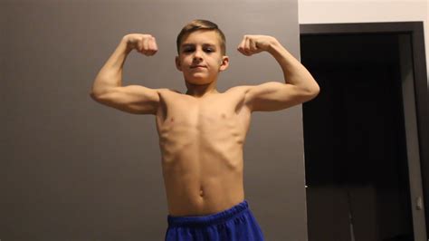 home kikboxing training  flexing  young bodybuilding star kid
