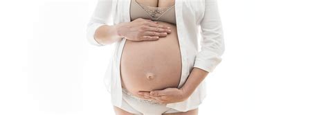 why innie belly buttons pop out during pregnancy and