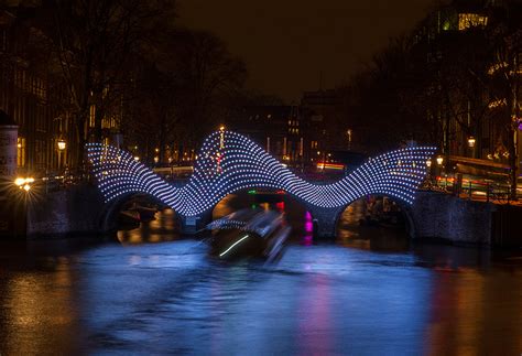 tjep illuminates amsterdam s canals with undulating light