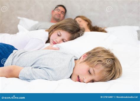 family sleeping  bed stock image image