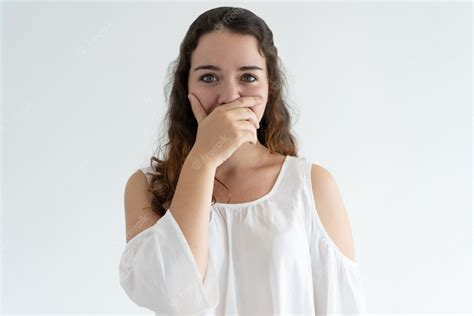 Free Photo Embarrassed Lovely Woman Covering Mouth With Hand