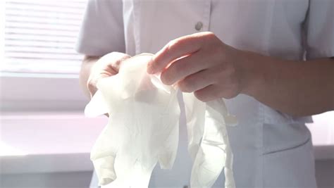 women doctor wearing a latex glove close up stock footage