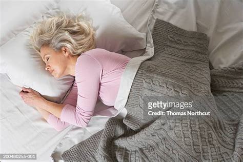 Sleeping Mature Woman Bed Photos And Premium High Res Pictures Getty