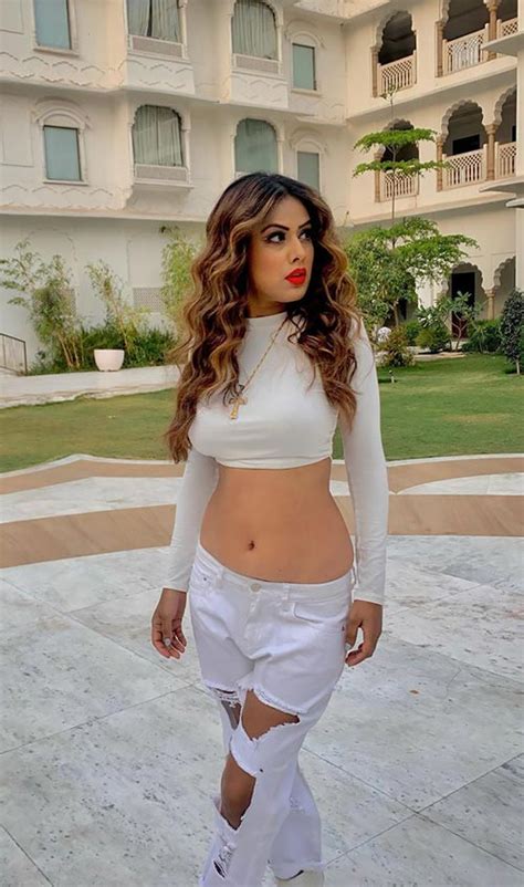 Nia Sharma Flaunting Her Ample Cleavage And Pierced Navel In These All