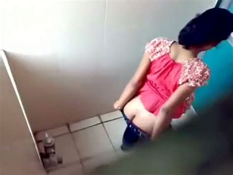 some amateur indian brunette gals peeing in the toilet on
