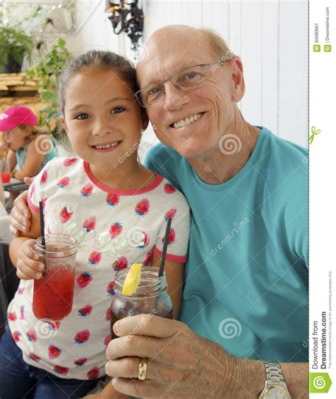 beautiful amerasian girl with her grandpa editorial photo image of