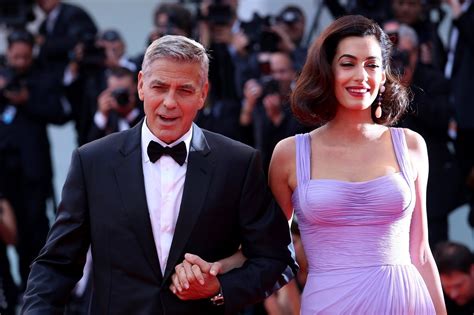 george and amal look so in love during their first public