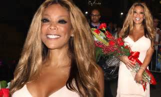 wendy williams receives a big bouquet of roses as the