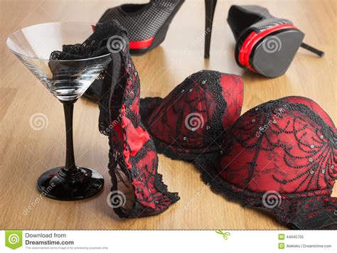 Panties In A Martini Glass On The Background Of Shoes And Bra Stock
