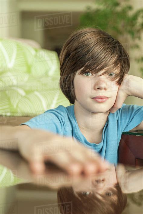 teenage boy relaxing  home portrait stock photo dissolve