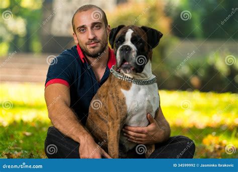 young man  dog stock photo image  animals friendship