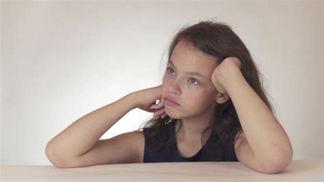 beautiful sad teenage girl expresses resentment  sadness  white background stock footage