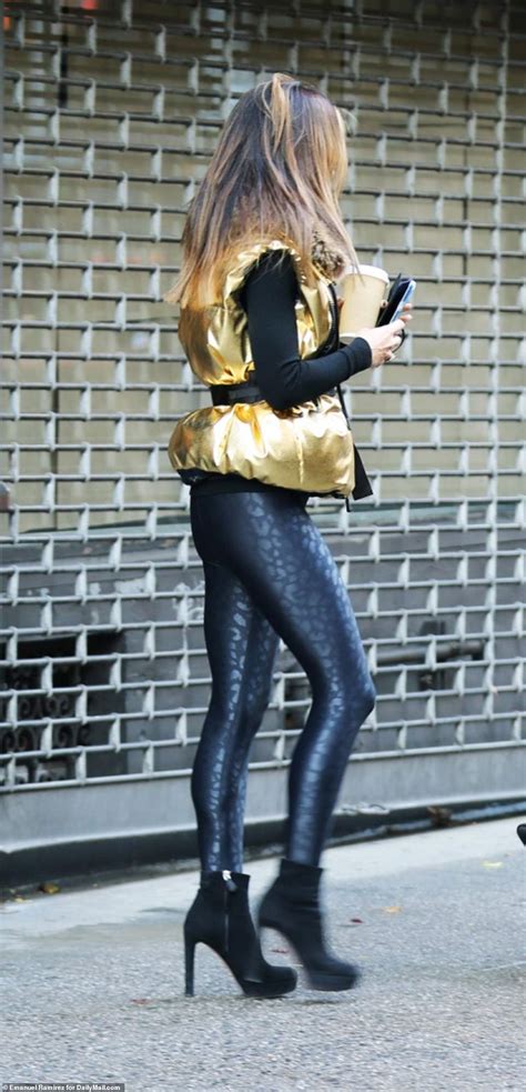 hilaria baldwin steps out in electric metallic leggings with alec hours