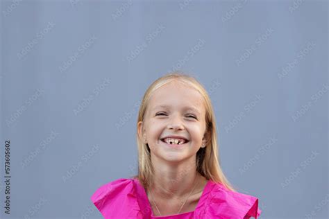 candid portrait of cute little caucasians blue eyed girl with blonde