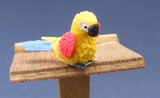 dolls house miniature baby parrots