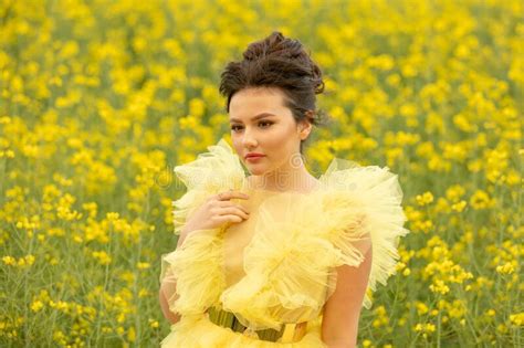 Portrait Of Romantic Brunette Teen Girl Wearing At Yellow