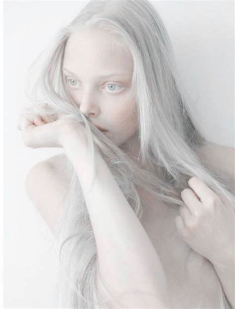 woman  long white hair posing   camera