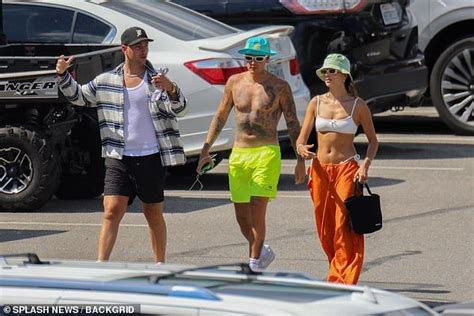 justin bieber and bikini clad wife hailey showcase their toned bodies