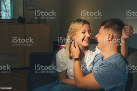 Cheerful Caucasian Couple Touching Each Other And Embracing Sweetly