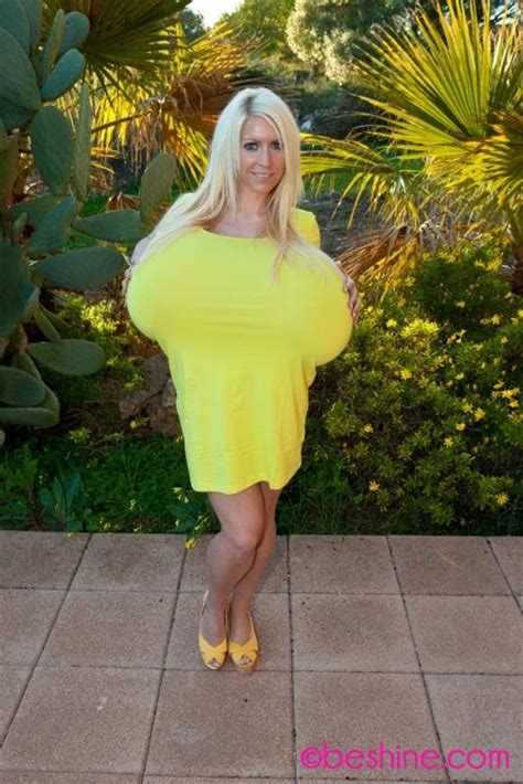 beshine in a tight yellow dress the boobs blog