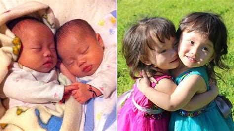 twins holding hands photos that show power of twin bond