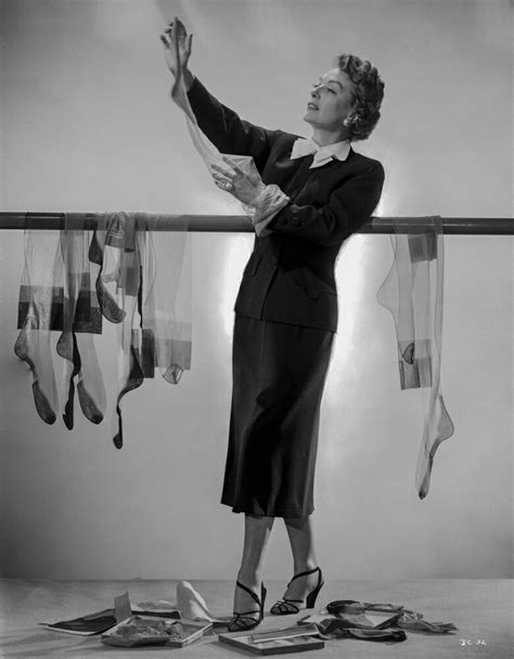 posterazzi joan crawford holding her stockings in a classic portrait