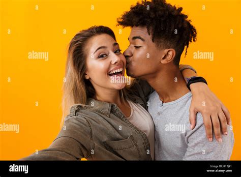 Image Of Happy Cute Young Loving Couple Posing Isolated Over Yellow