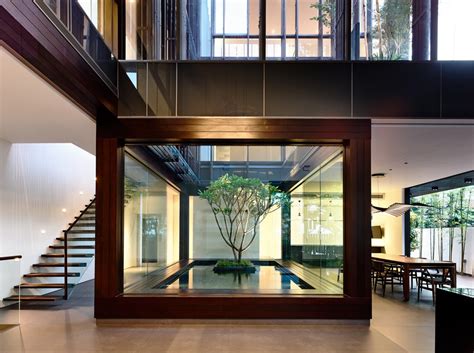 open tropical home  interior courtyard  wood features