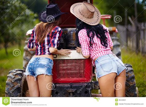 Sexy Female Farmers Fixing The Tractor Stock Image Image 36440651