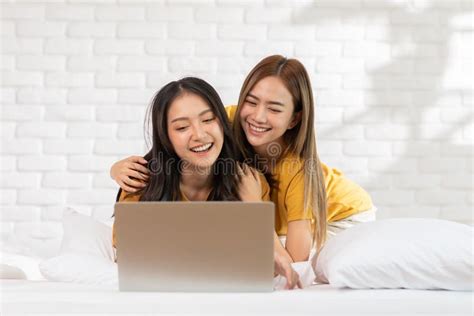 Beautiful Asian Young Lesbian Lgbtq Couple Or Friends Using Computer