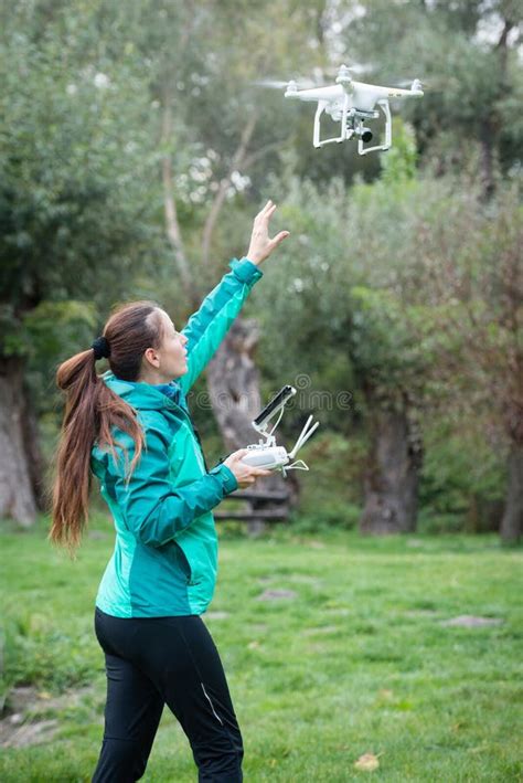 young woman flying  drone   nature stock photo image  modern flight