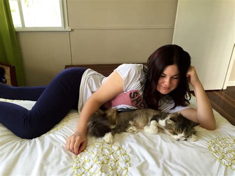 beautiful brunette in leggings with the perfect figure laying next to her cat porn photo eporner