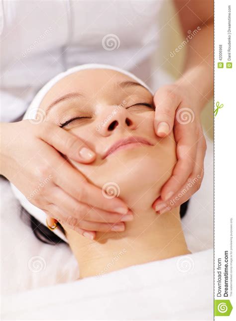 Woman In The Beauty Spa Getting A Facial Massage Stock
