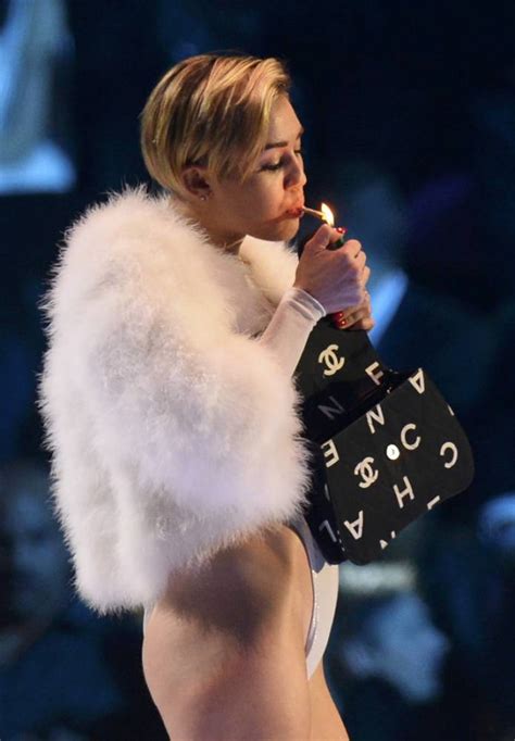 Miley Cyrus Lets Her Crotch Hang Out As She Smokes