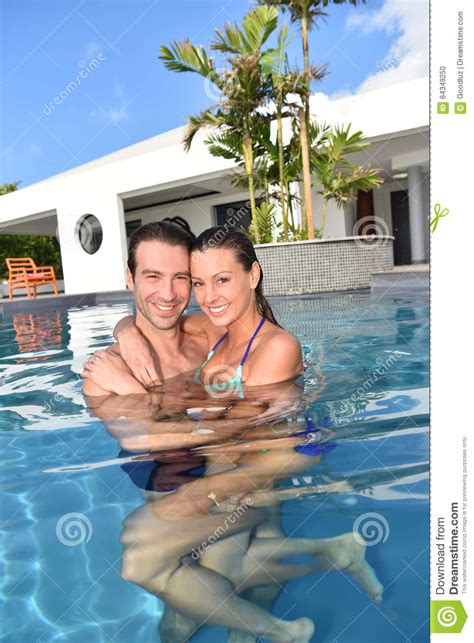 Happy Couple In Love In A Private Swimming Pool Stock