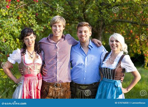 happy group  bavarian people stock photo image  trouser